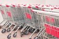 Many same shop trolley. Retail consumer carts. Empty parking store mall. Outside Royalty Free Stock Photo
