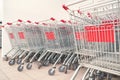 Many same shop trolley. Retail consumer carts. Empty parking store mall. Outside Royalty Free Stock Photo