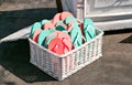 Many sandal have many color. Schists pink and green in a basket