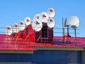 Many satellite dishes are installed on the roof Royalty Free Stock Photo