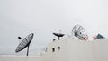 Many satellite dishes on the roof Royalty Free Stock Photo