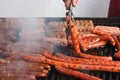 Many sausages on grill Royalty Free Stock Photo
