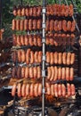 Many sausages roasted on a vertical grill in a caribbean  style barbecue Royalty Free Stock Photo