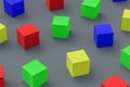 Many scattered colorful toy cubes on gray background