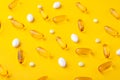 Many scattered pharmaceutical medicine vitamins, pills, fish oil softgel, tablets