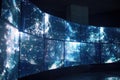 Video wall showing abstract data visualisation in dark control room Royalty Free Stock Photo