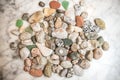 Many sea colored stones, sea stones on marble, composition of rocks, composition of sea stones, sea stones on marble slab