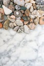 Many sea colored stones, sea stones on marble, composition of rocks, composition of sea stones, sea stones on marble slab,