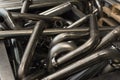 Many seamless metal curved pipes in the factory