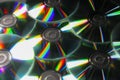 Many shiny compact discs as background, closeup Royalty Free Stock Photo
