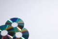 Many shiny compact discs on light background. Space for text Royalty Free Stock Photo