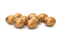 Many shiny golden eggs on white Royalty Free Stock Photo