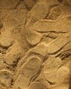 Many shoe footprints on the yellow sand Royalty Free Stock Photo