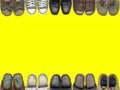 Many of shoes and sandal on isolate yellow background.