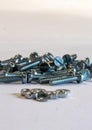 Many silver metric machine screws Royalty Free Stock Photo