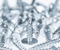 Many silver screws toned grey Royalty Free Stock Photo