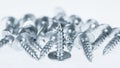 Many silver screws toned grey Royalty Free Stock Photo