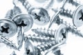 Many silver screws toned grey Royalty Free Stock Photo