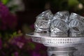 Many silver water bowl on silver tray for using pour sacred water to older people in Songkran festival