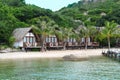 many similar tropical houses with palms on a beach of south china sea in Vietnam Royalty Free Stock Photo