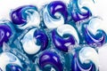 Many simple blue white detergent pods. Lots of washing machine pods macro, closeup. Home domestic equipment, cleaning washing Royalty Free Stock Photo