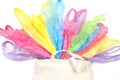 Many single use plastic bags in one eco natural reusable shopping bag on white background. Zero waste, eco friendly, no