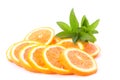 Many sliced oranges and green plant Royalty Free Stock Photo