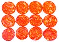 Many slices of pepperoni salami isolated on white