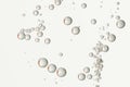 Bubbles flowing over a light grey background Royalty Free Stock Photo