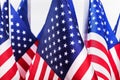 Many small American flags on light background Royalty Free Stock Photo