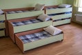 Many small beds in daycare preeschool empty bedroom Royalty Free Stock Photo