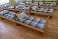 Many small beds in daycare preeschool empty bedroom Royalty Free Stock Photo