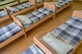Many small beds in daycare preeschool empty bedroom Royalty Free Stock Photo