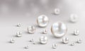 Many small and big white pearls on white and grey bokeh backgrou