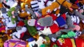 Many small, colorful, knitted finger puppets. Self-made for sale at a flea market. Close-up