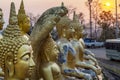 Many small,golden Buddha statues at sunset on Wat Phousalao,hilltop temple,overlooking the Mekong River and Pakse,Laos Royalty Free Stock Photo