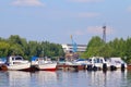 Many small modern motorboats at pier on river Royalty Free Stock Photo