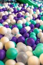 many small multi-colored plastic balls in the pool desk Royalty Free Stock Photo
