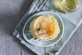 Many small pancakes with honey or syrup. Delicious traditional breakfast. Spring flowers as food styling in photography. Gray Royalty Free Stock Photo