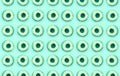 Many small plastic donuts lies on a pastel colorful background. Flat lay minimal pattern. Top view Royalty Free Stock Photo