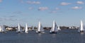 Many small sailboats in the Great South Bay competiting in a wnter regatta Royalty Free Stock Photo