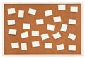 Many small sheets of paper on bulletin cork board