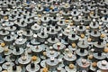 Many small used electric motors as background