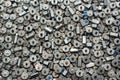 Many small used electric motors as background