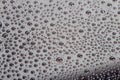 Many small water drops on the surface of cellphone hydrophobic coated glass screen