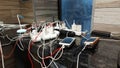 Many smartphone gadgets are charged from a single power strip in a store in Ukraine. Shortage of electricity in Ukraine