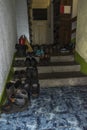 Many sneakers and mountain shoes in the corridor of the Kozya St