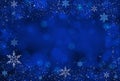 Blue Christmas winter background with snowflakes