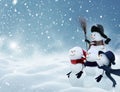 Many snowmen standing in winter Christmas landscape Royalty Free Stock Photo