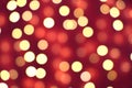 Many soft orange, red and yellow blurry bokeh light on dark red background in Christmas and New Year festival day Royalty Free Stock Photo